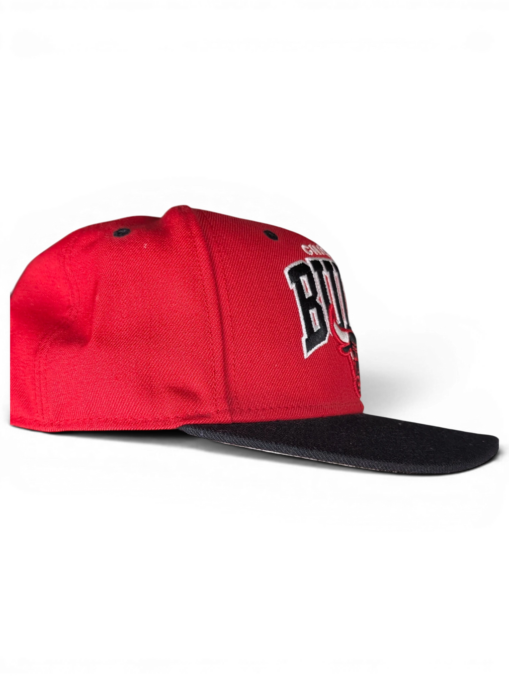 JAKE & IPI red and black Chicago Bulls snapback cap with embroidered team logo, side profile view