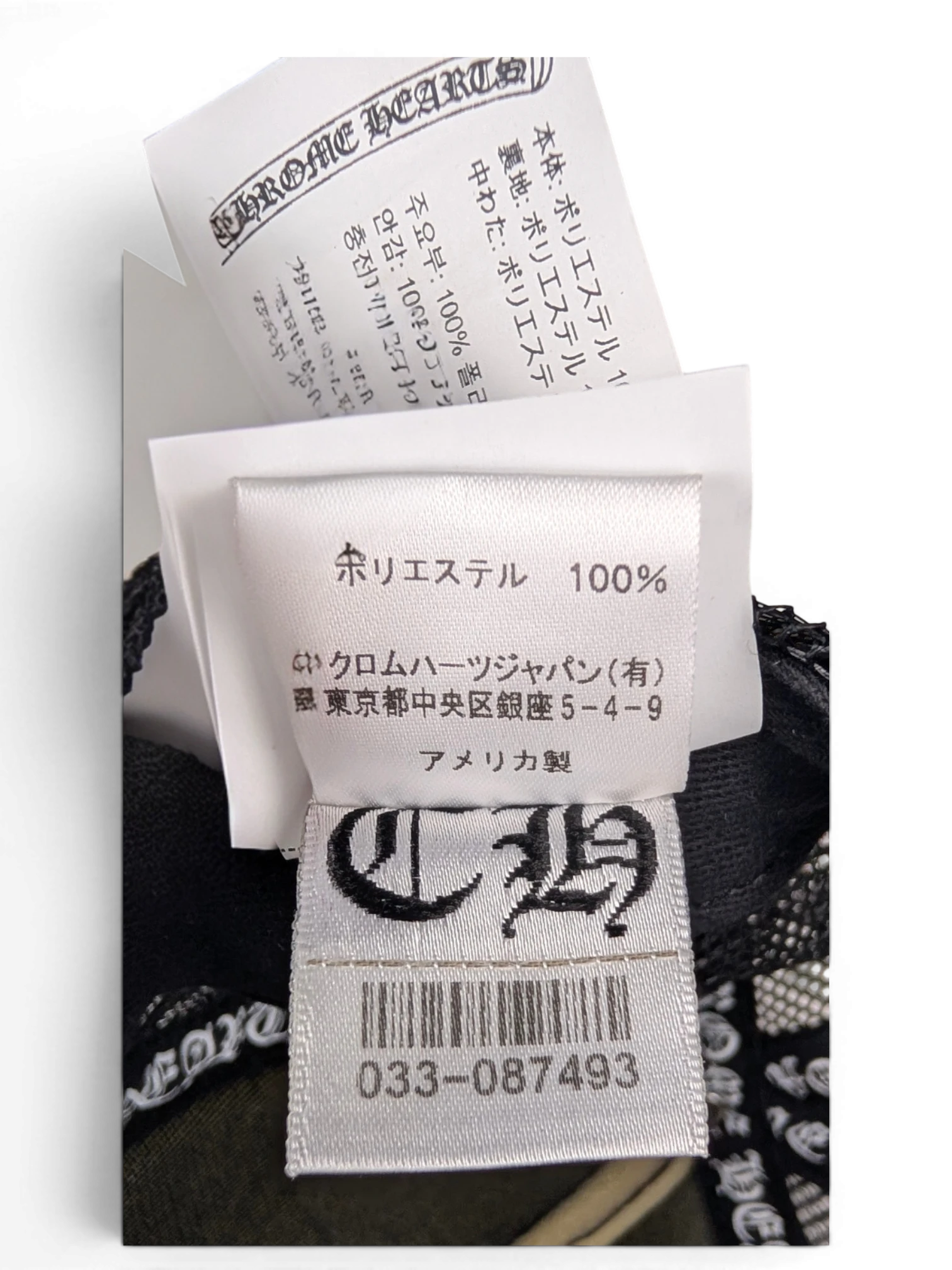 JAKE & IPI Chrome Hearts cap interior label showing 100 percent polyester material and brand logo details