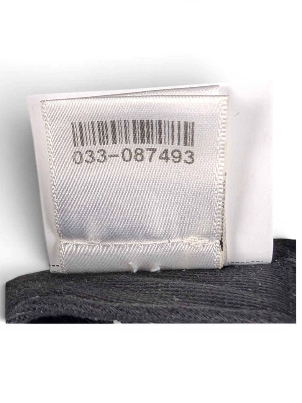 JAKE & IPI Chrome Hearts cap interior showing the white authenticity tag with barcode and black mesh lining