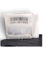 JAKE & IPI Chrome Hearts cap interior showing the white authenticity tag with barcode and black mesh lining