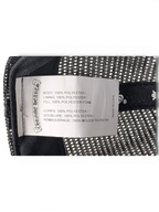 JAKE & IPI Chrome Hearts trucker hat interior label showing 100 percent polyester material composition