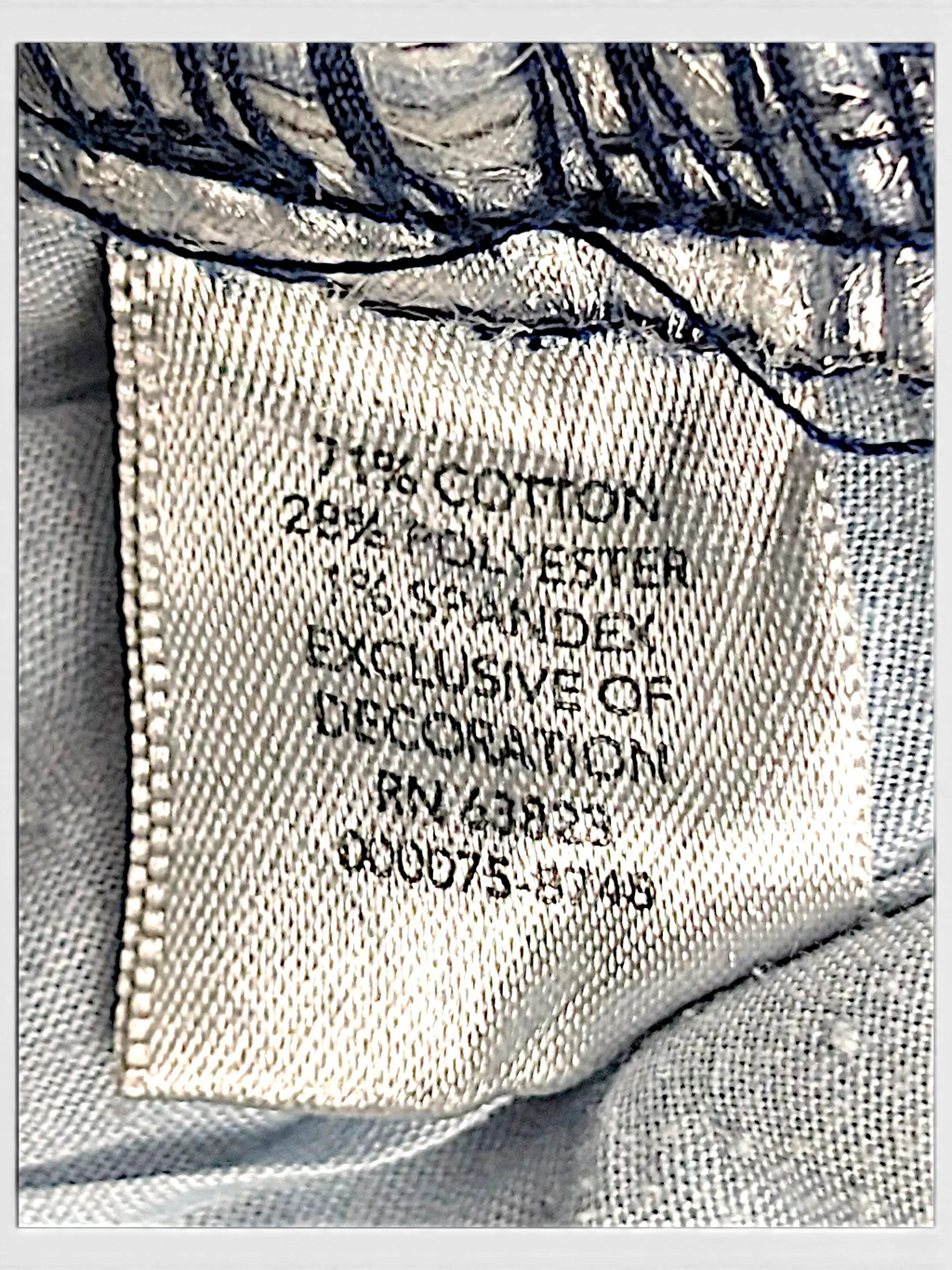 JAKE & IPI CJ Banks jeans fabric care label showing 71 percent cotton, 28 percent polyester, and 1 percent spandex