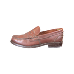 JAKE & IPI Clarks brown leather penny loafers with classic moccasin stitching and a low stacked heel.