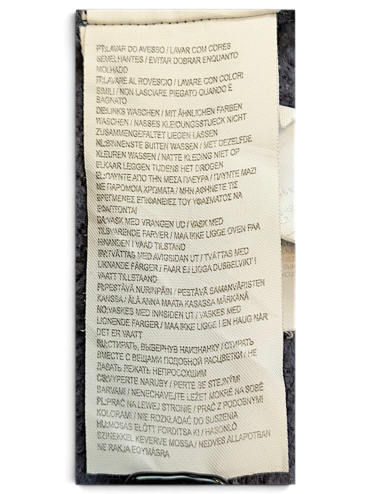 JAKE & IPI Converse Cropped College garment care label with multi-language washing instructions on navy fabric