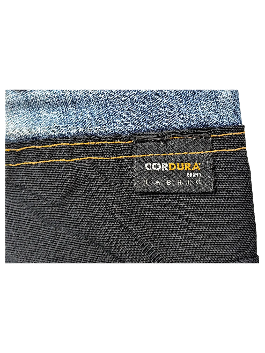 JAKE & IPI jeans featuring a black Cordura brand fabric panel with contrast orange stitching against blue denim