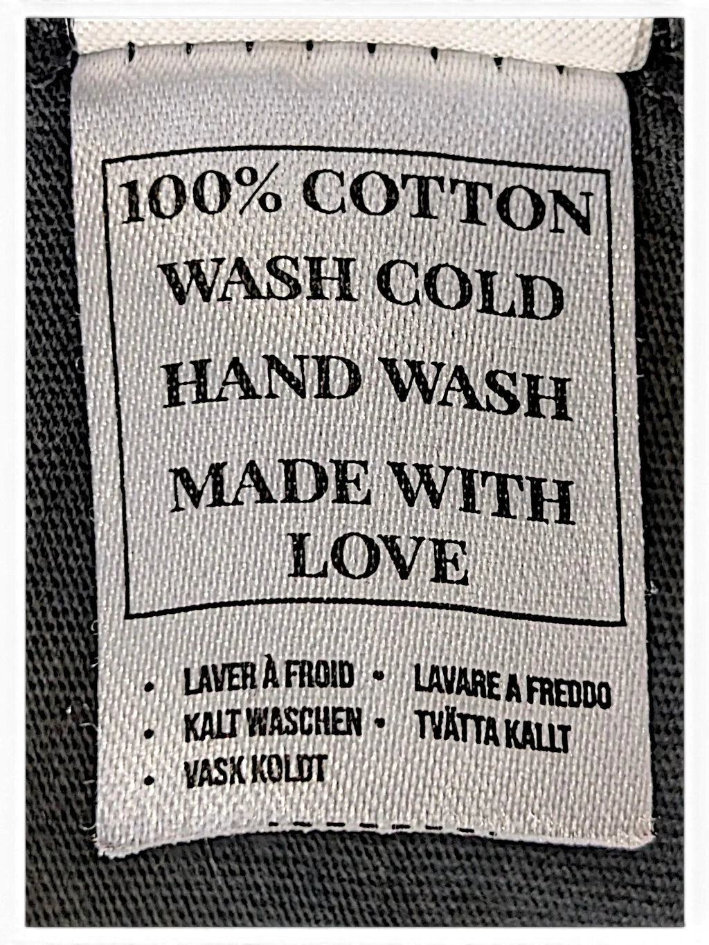 JAKE & IPI IBE Mori Velle long-sleeve garment care label showing 100% cotton material and hand wash instructions.