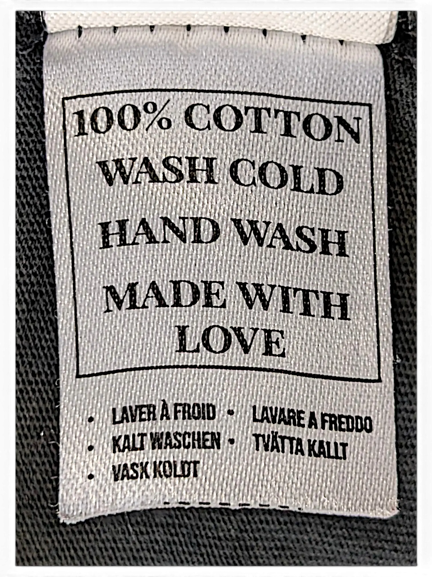 JAKE & IPI IBE Mori Velle long-sleeve garment care label showing 100% cotton material and hand wash instructions.