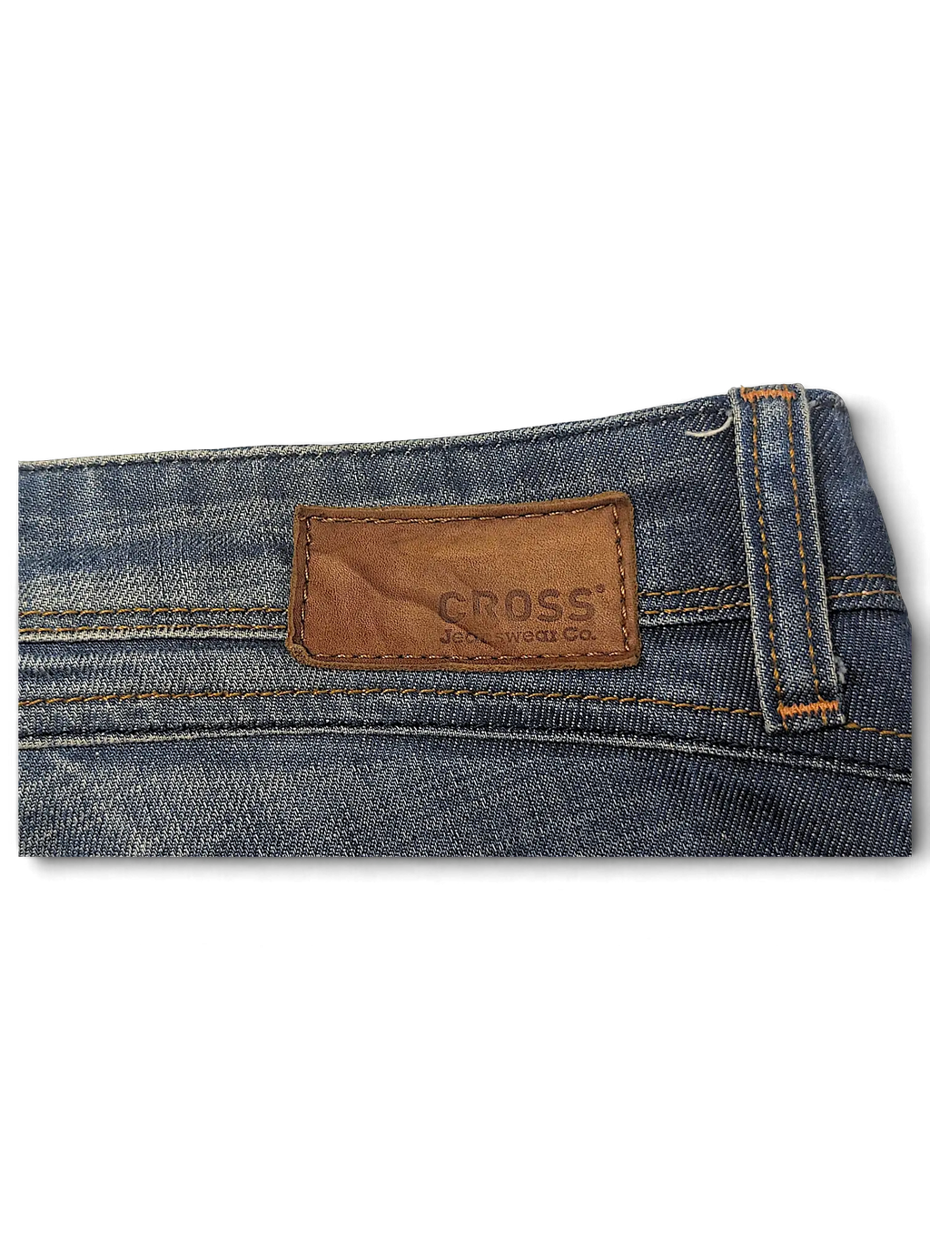 JAKE & IPI blue denim jeans featuring a brown leather patch with the Cross Jeanswear Co logo on the back waistband