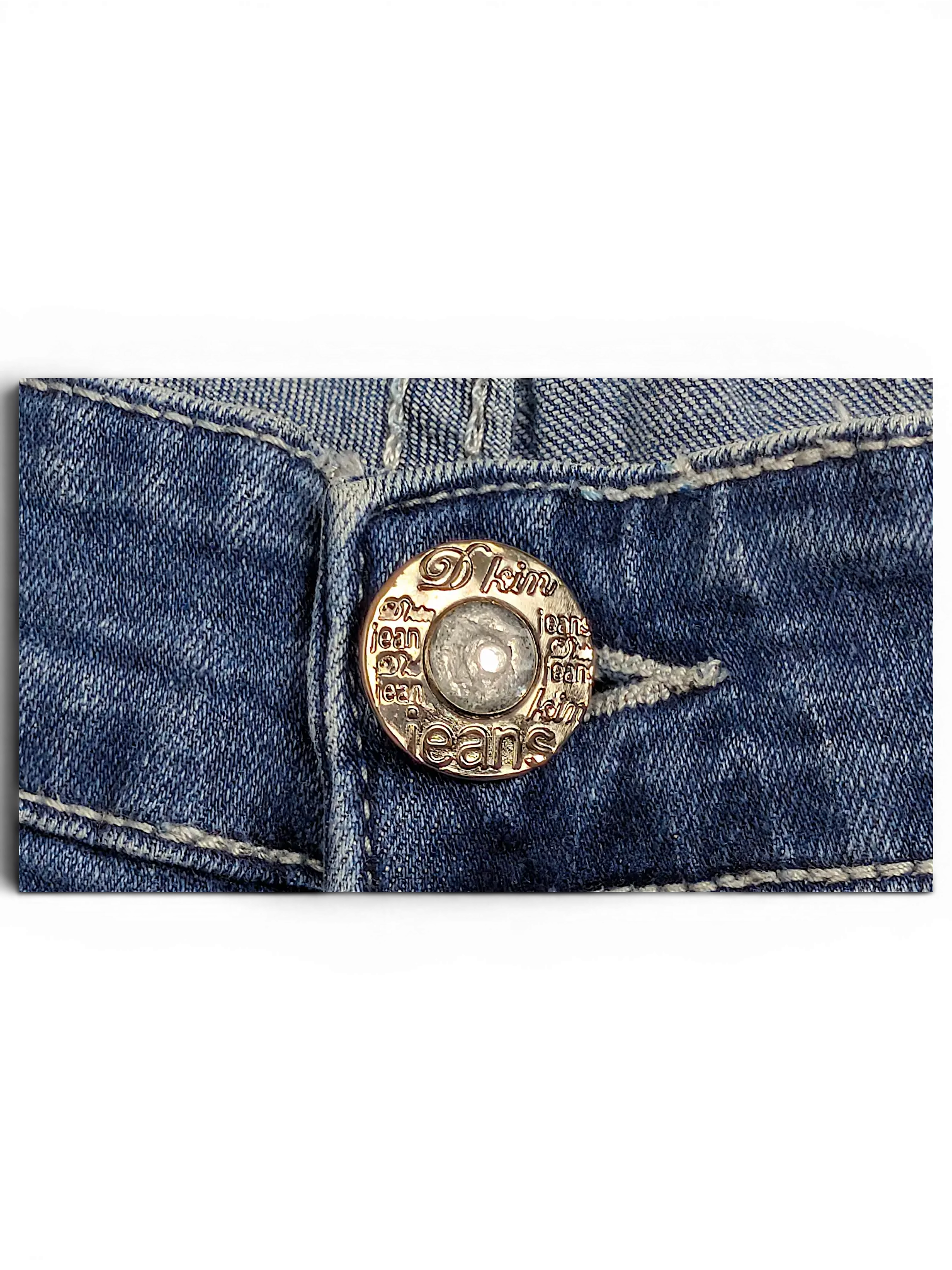 JAKE & IPI D Kin Jeans Wear blue denim jeans featuring a gold-tone metal button with engraved branding and a crystal