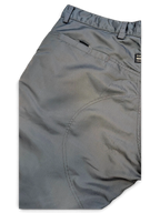 JAKE & IPI Cower dark green cargo pants featuring a zippered back pocket and reinforced stitching details.