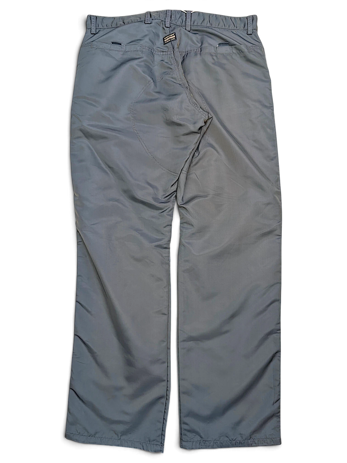 JAKE & IPI Cower dark green cargo pants featuring a reinforced seat panel and back pockets on a black background.