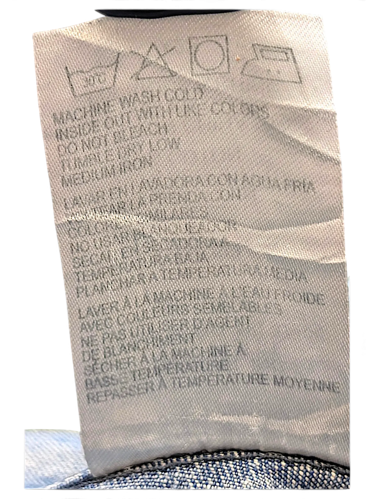 JAKE & IPI Wrangler blues denim jacket care label with washing instructions in English, Spanish, and French