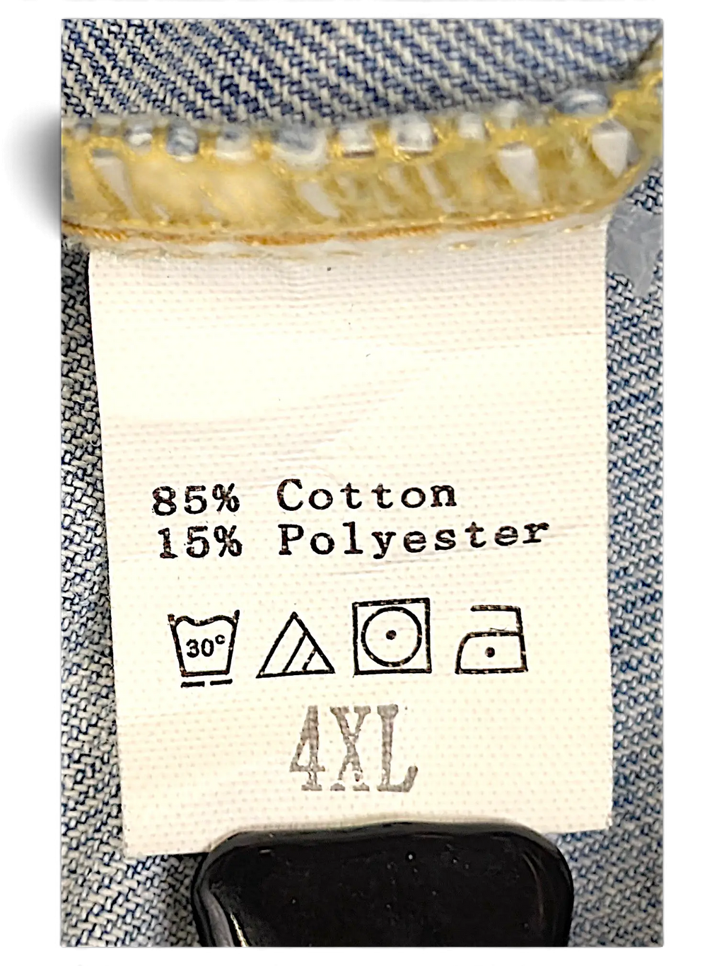 JAKE & IPI distressed denim jacket care label showing 85% cotton and 15% polyester blend with 4XL sizing