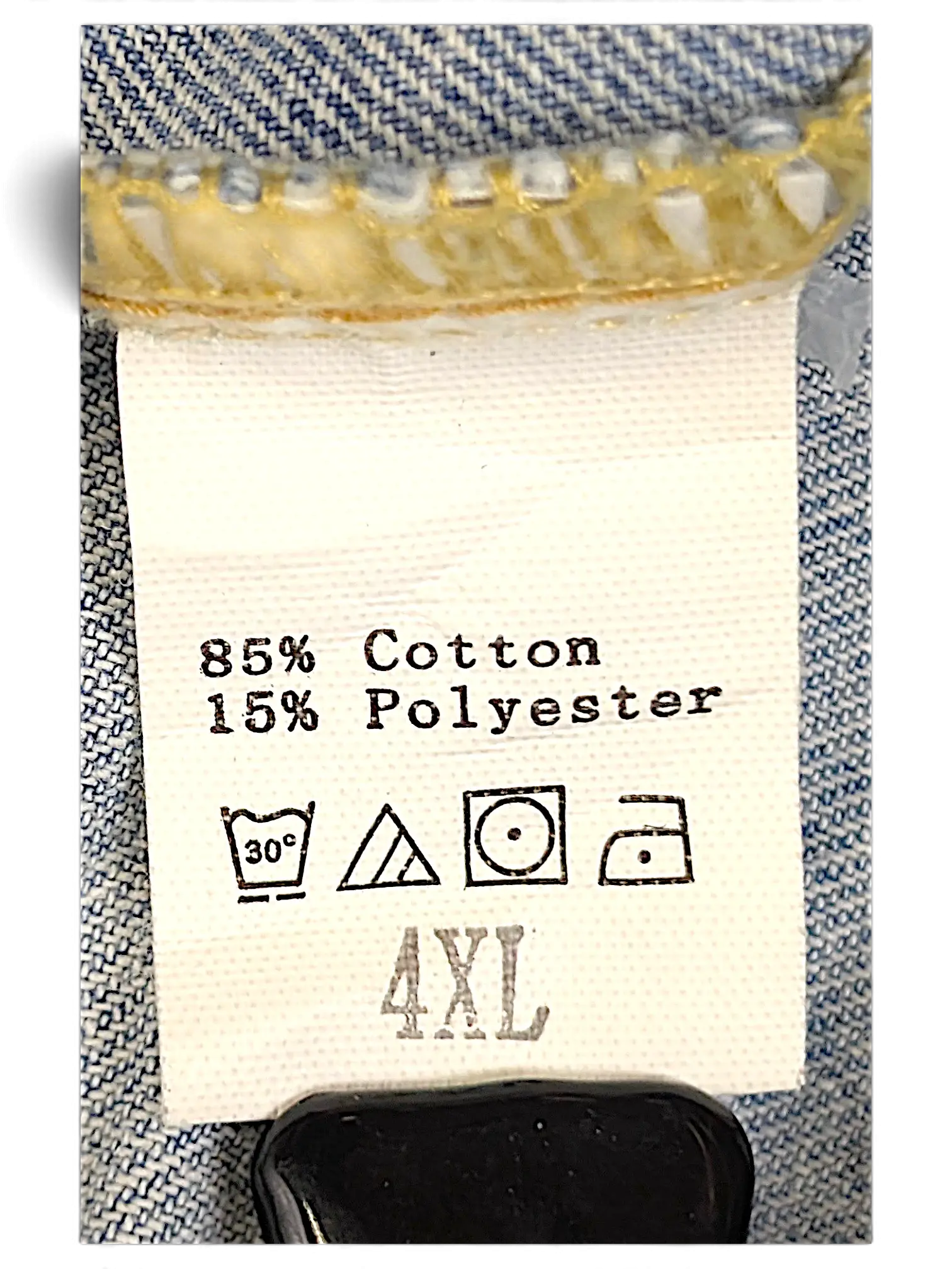 JAKE & IPI distressed denim jacket care label showing 85% cotton and 15% polyester blend with 4XL sizing
