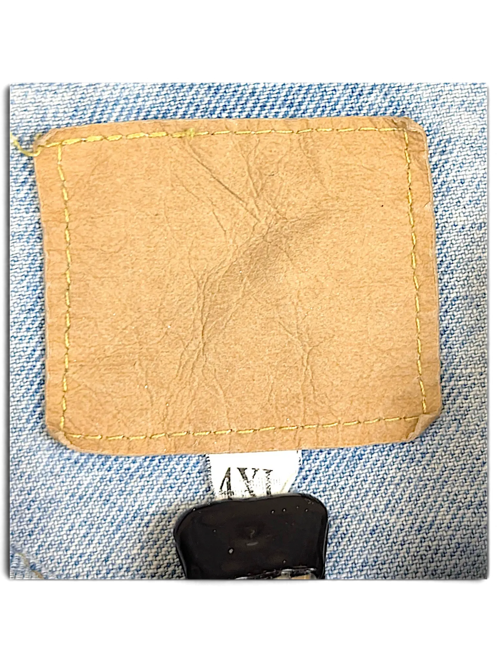 JAKE & IPI distressed denim jacket featuring a tan leather-look brand patch and 4XL size label