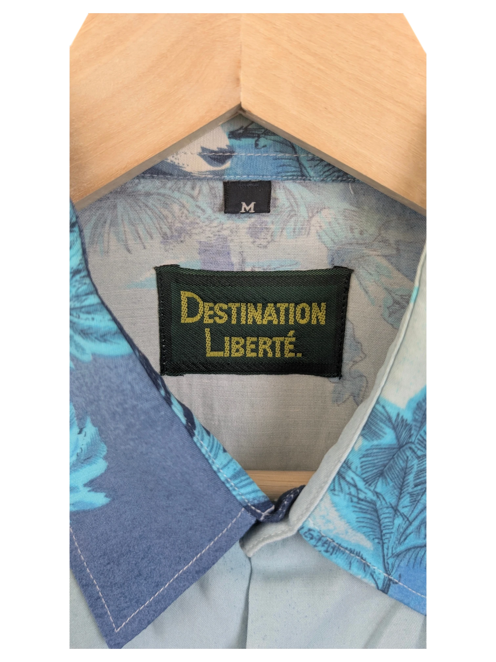 JAKE & IPI Destination Liberté Hawaiian shirt featuring a blue tropical floral print and a size M label.