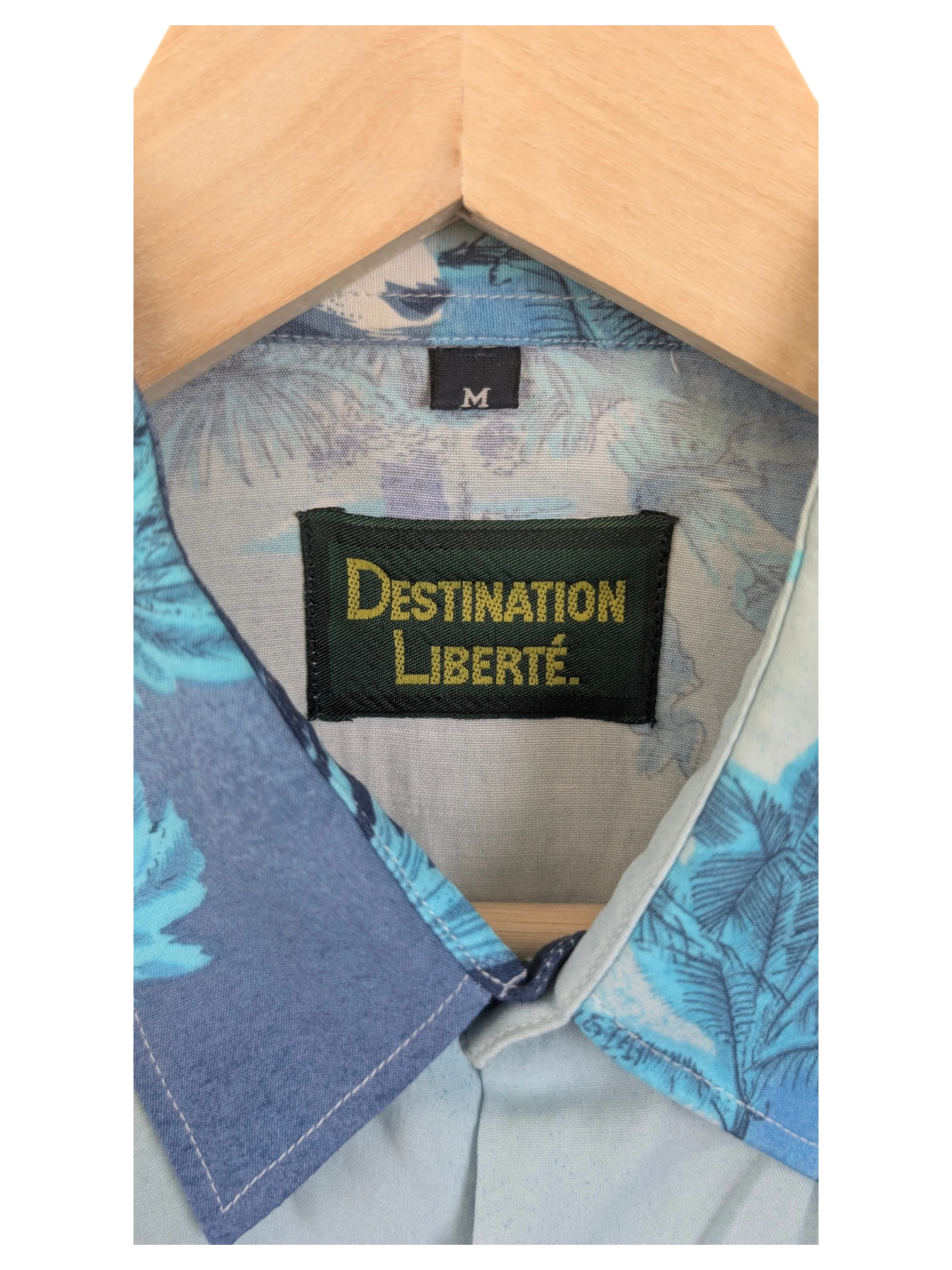JAKE & IPI Destination Liberté Hawaiian shirt featuring a blue tropical floral print and a size M label.
