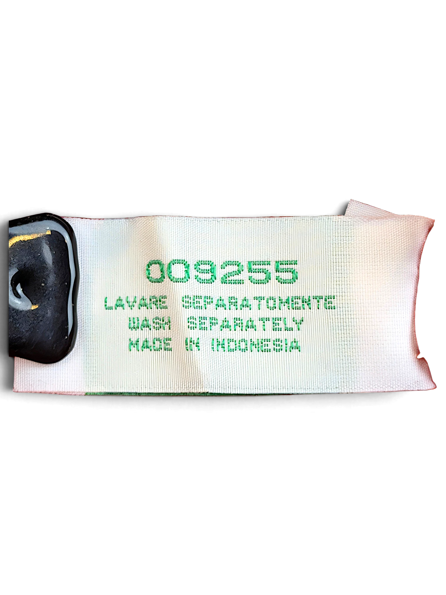 JAKE & IPI Diadora track pants care label with washing instructions and made in Indonesia text