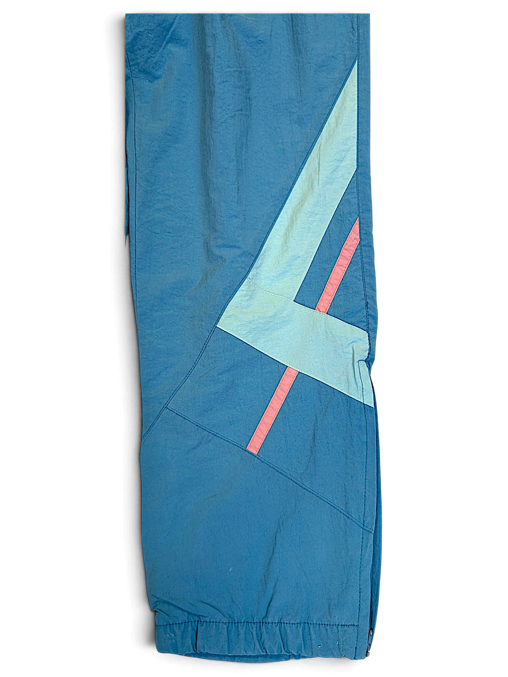 JAKE & IPI Diadora faded light blue track pants with geometric paneling and pink accent stripes