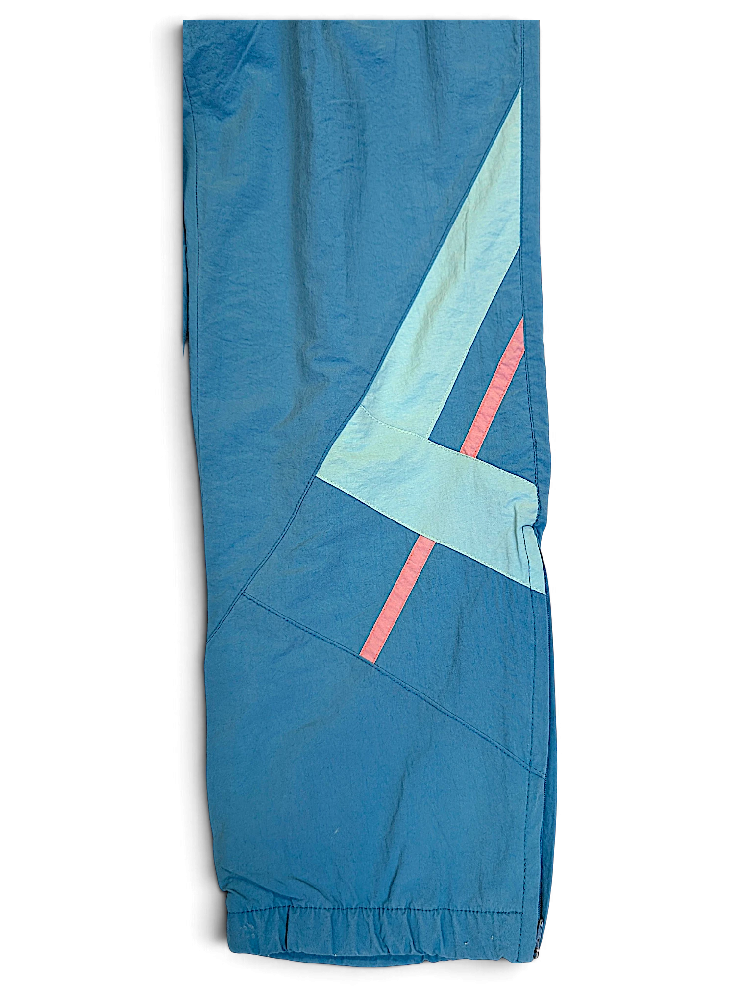 JAKE & IPI Diadora faded light blue track pants with geometric paneling and pink accent stripes