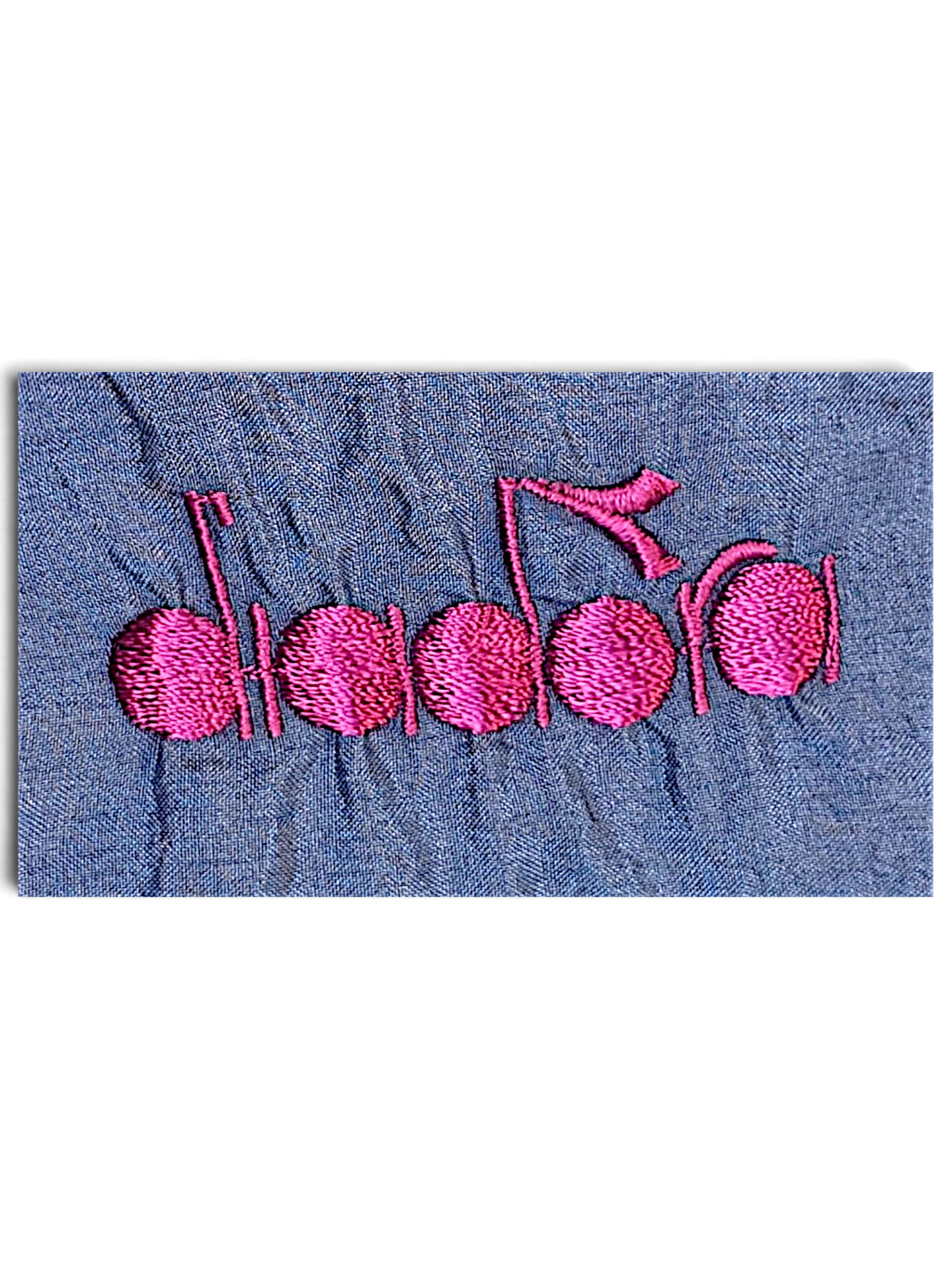 JAKE & IPI Diadora track pants featuring bright pink embroidered logo on shiny light blue fabric