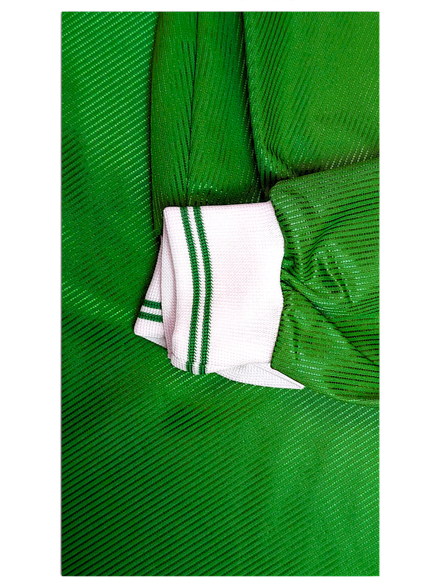 JAKE & IPI Diadora Roma green football shirt showing the white striped ribbed cuff