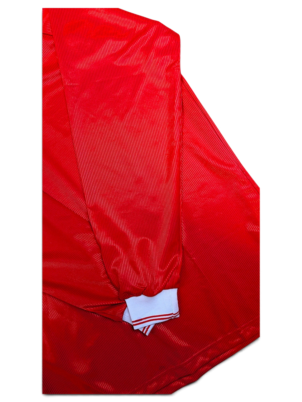 JAKE & IPI Diadora Roma red football shirt showing the white striped ribbed cuff
