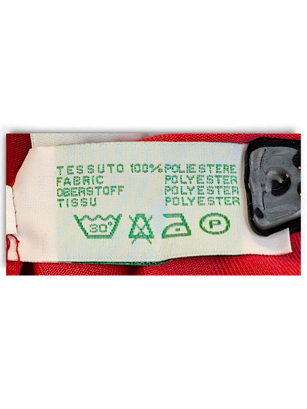 JAKE & IPI Diadora track pants care label showing 100 percent polyester composition and washing instructions