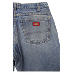 JAKE & IPI Dickies blue denim jeans featuring a classic five-pocket construction and a red logo patch on the back.