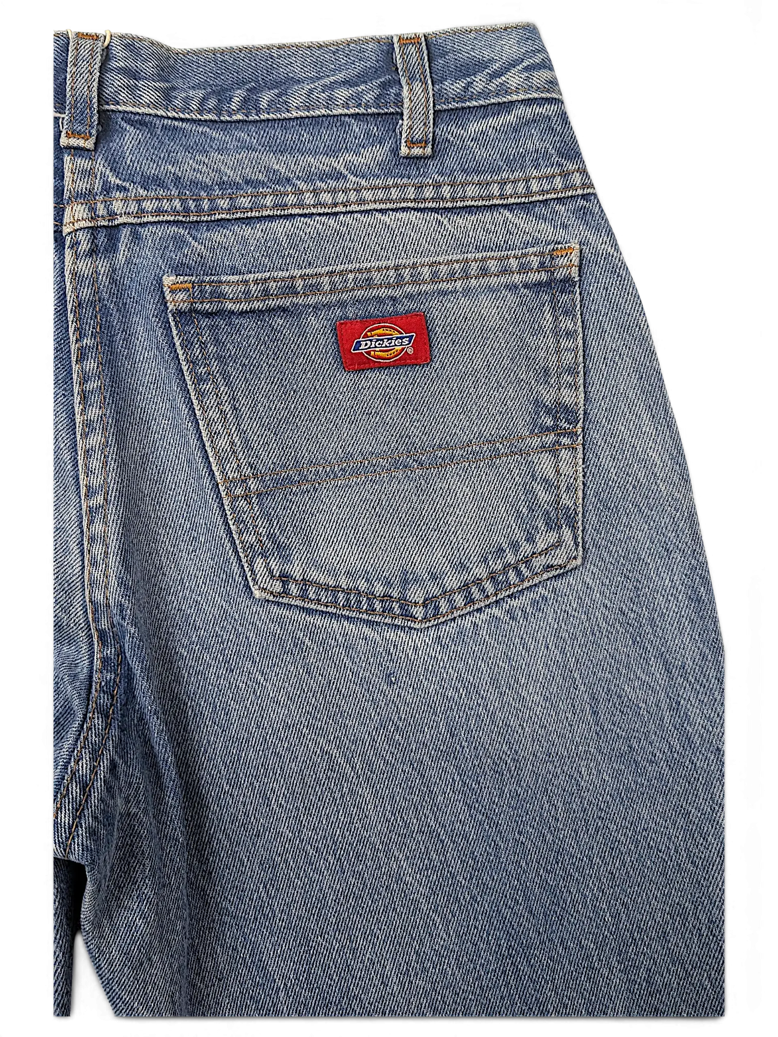 JAKE & IPI Dickies blue denim jeans featuring a classic five-pocket construction and a red logo patch on the back.