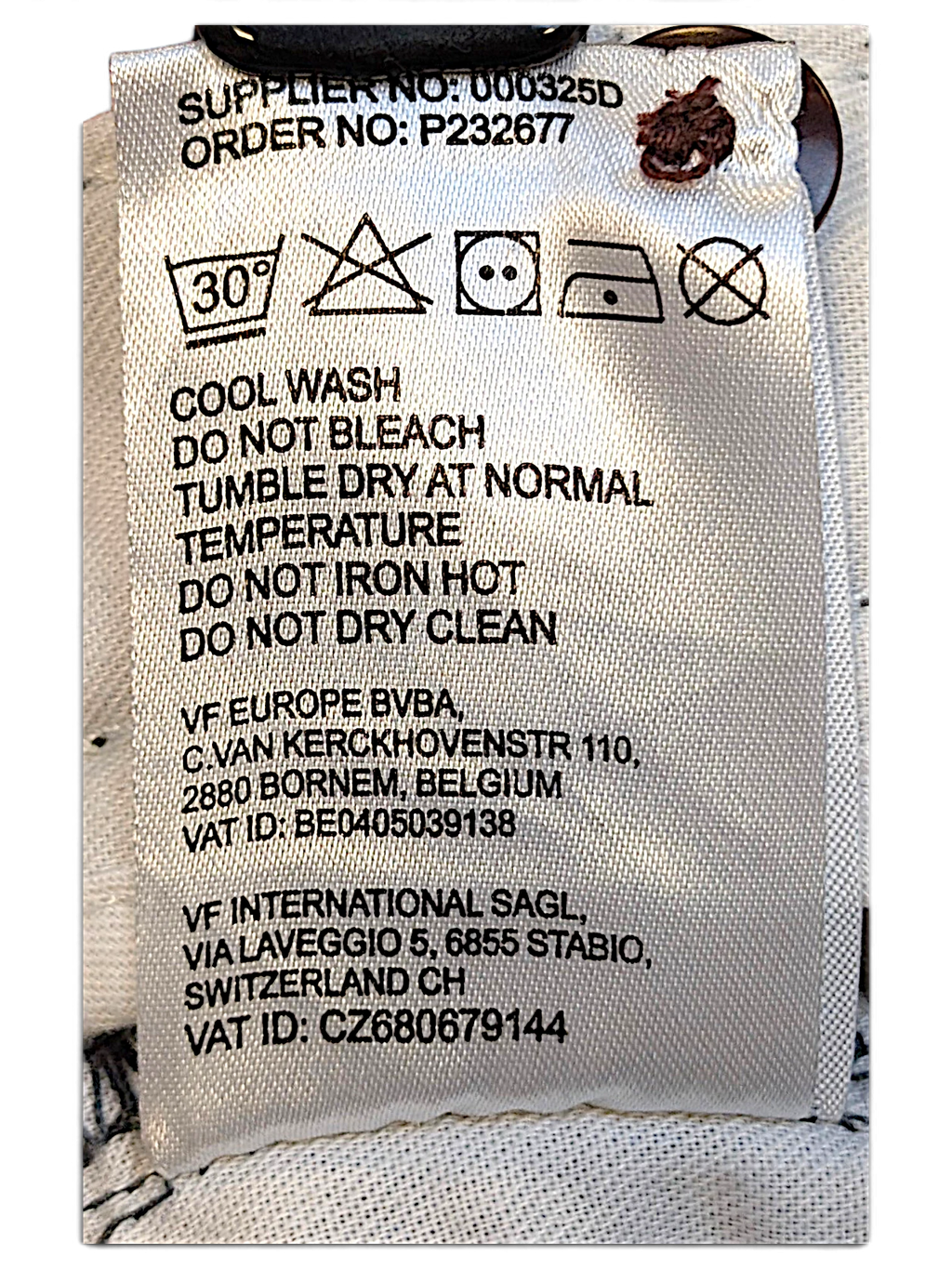 JAKE & IPI Dickies trousers care label with washing instructions and supplier information