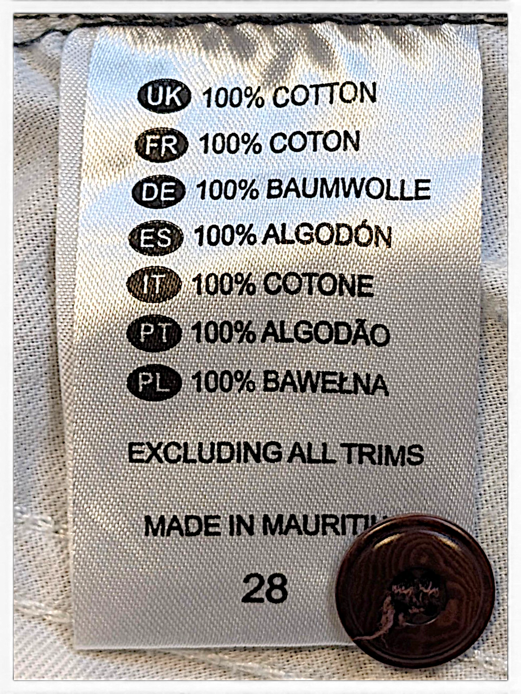 JAKE & IPI Dickies trousers care label showing 100% cotton composition and size 28