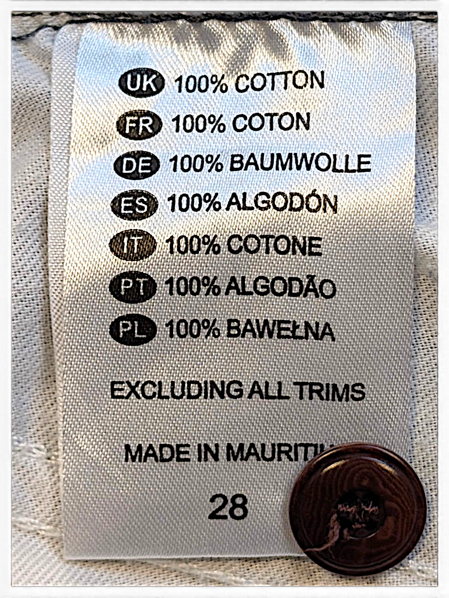 JAKE & IPI Dickies trousers care label showing 100% cotton composition and size 28