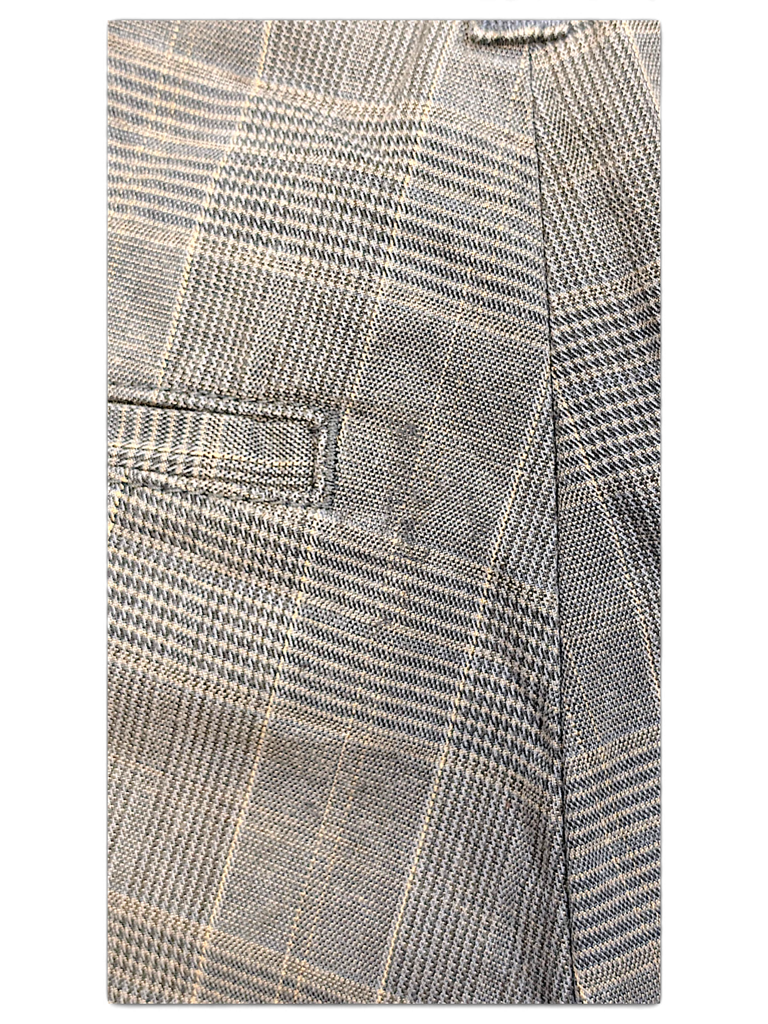 Close-up of JAKE & IPI Dickies grey plaid pleated trousers showing the textured fabric and pocket detail.