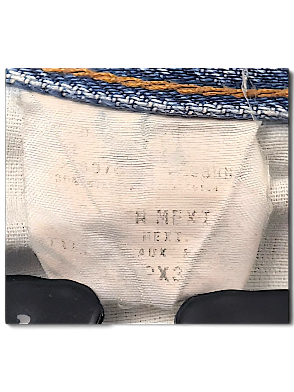 JAKE & IPI Dickies jeans interior care label and size tag detail on blue denim fabric