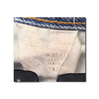 JAKE & IPI Dickies jeans interior care label and size tag detail on blue denim fabric
