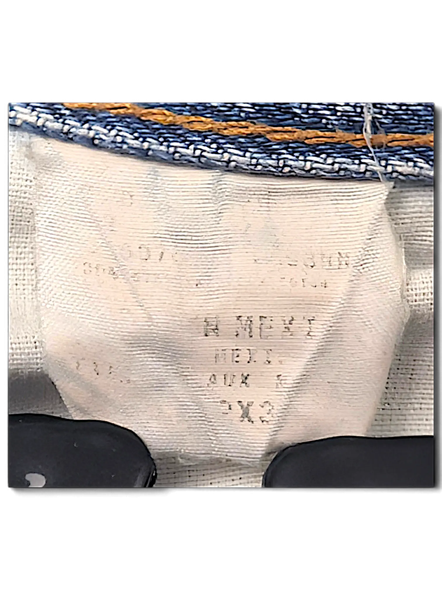 JAKE & IPI Dickies jeans interior care label and size tag detail on blue denim fabric