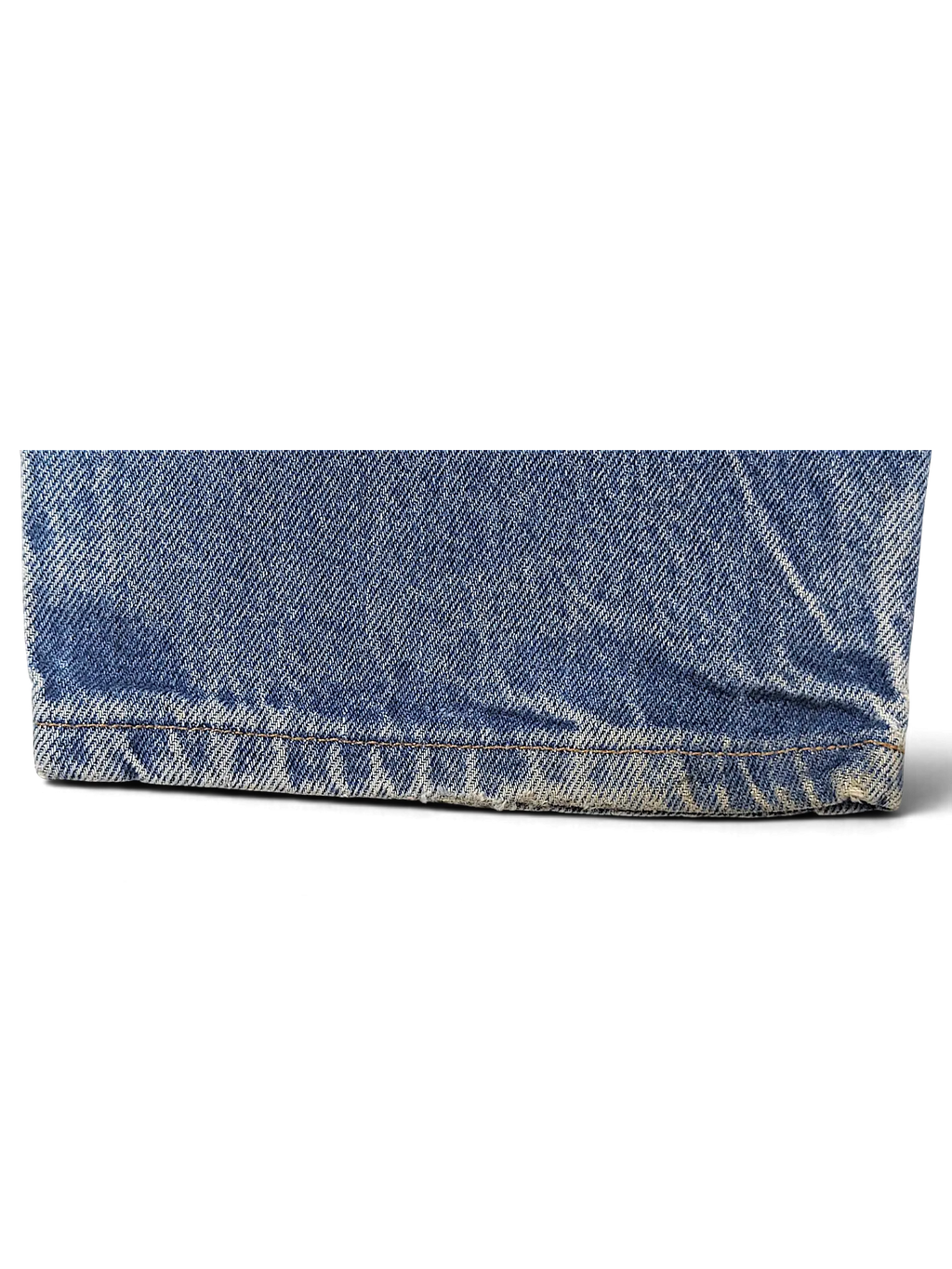 Close-up of the frayed hem on blue denim JAKE & IPI Dickies jeans showing authentic wear and texture.
