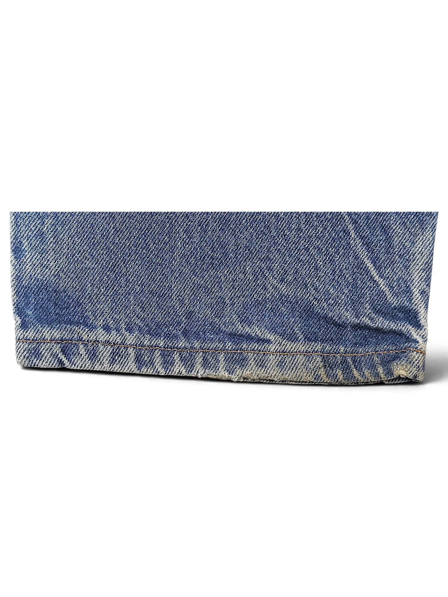 Close-up of the frayed hem on blue denim JAKE & IPI Dickies jeans showing authentic wear and texture.