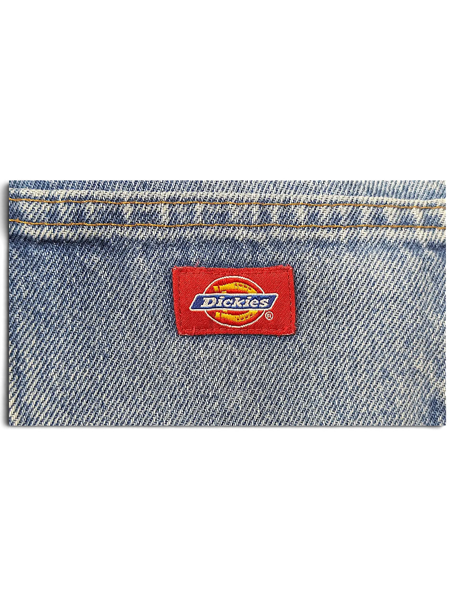 JAKE & IPI Dickies jeans featuring a classic red brand logo patch stitched onto blue denim fabric.