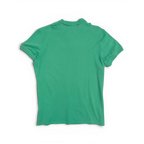 Back view of a pre-owned JAKE & IPI green Diesel short-sleeve polo shirt against a black background.