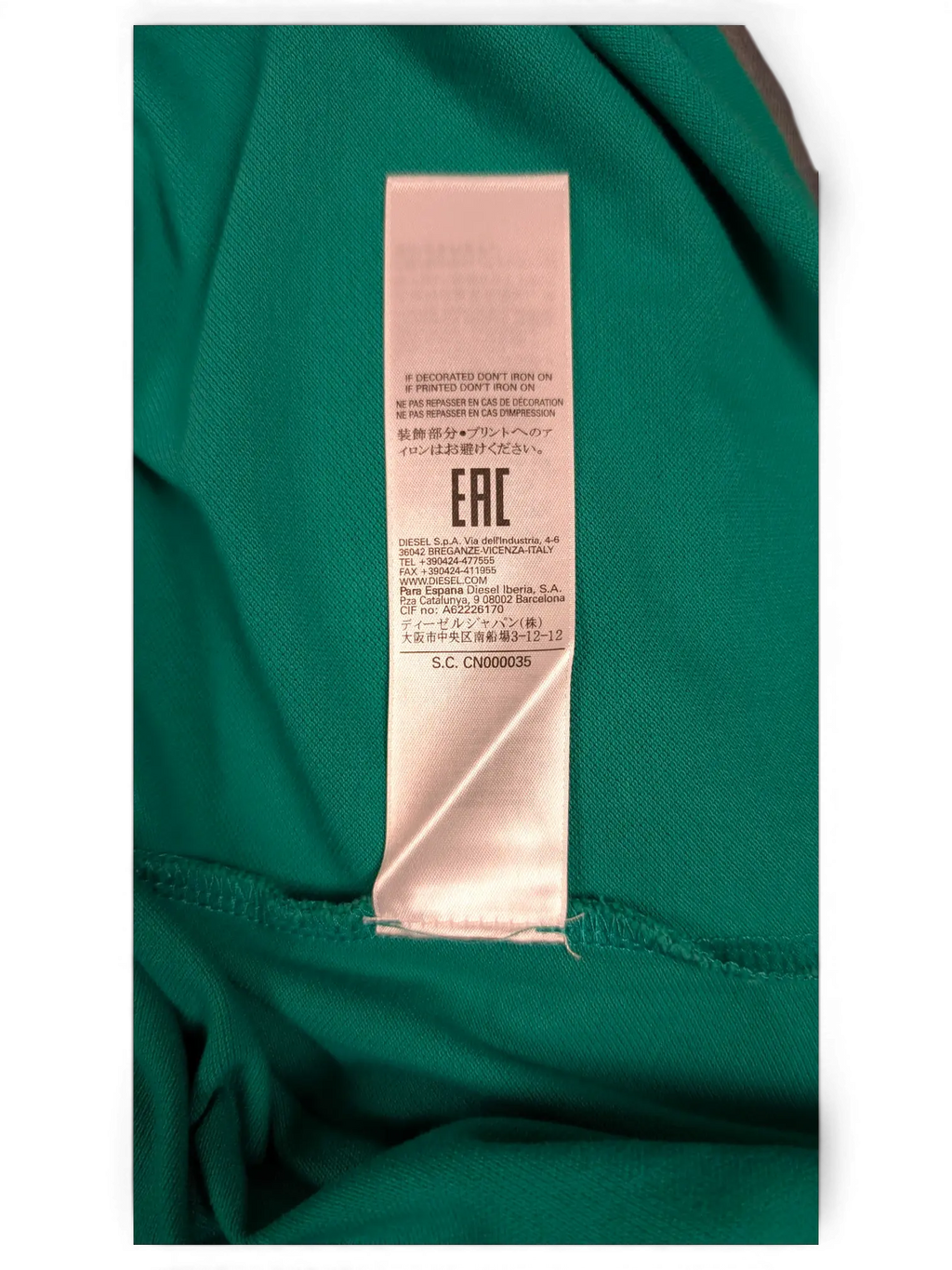 JAKE & IPI pre-owned green Diesel polo shirt care label and fabric detail
