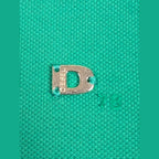 JAKE & IPI pre-owned Diesel green polo shirt featuring a small silver metal D logo detail on the chest.