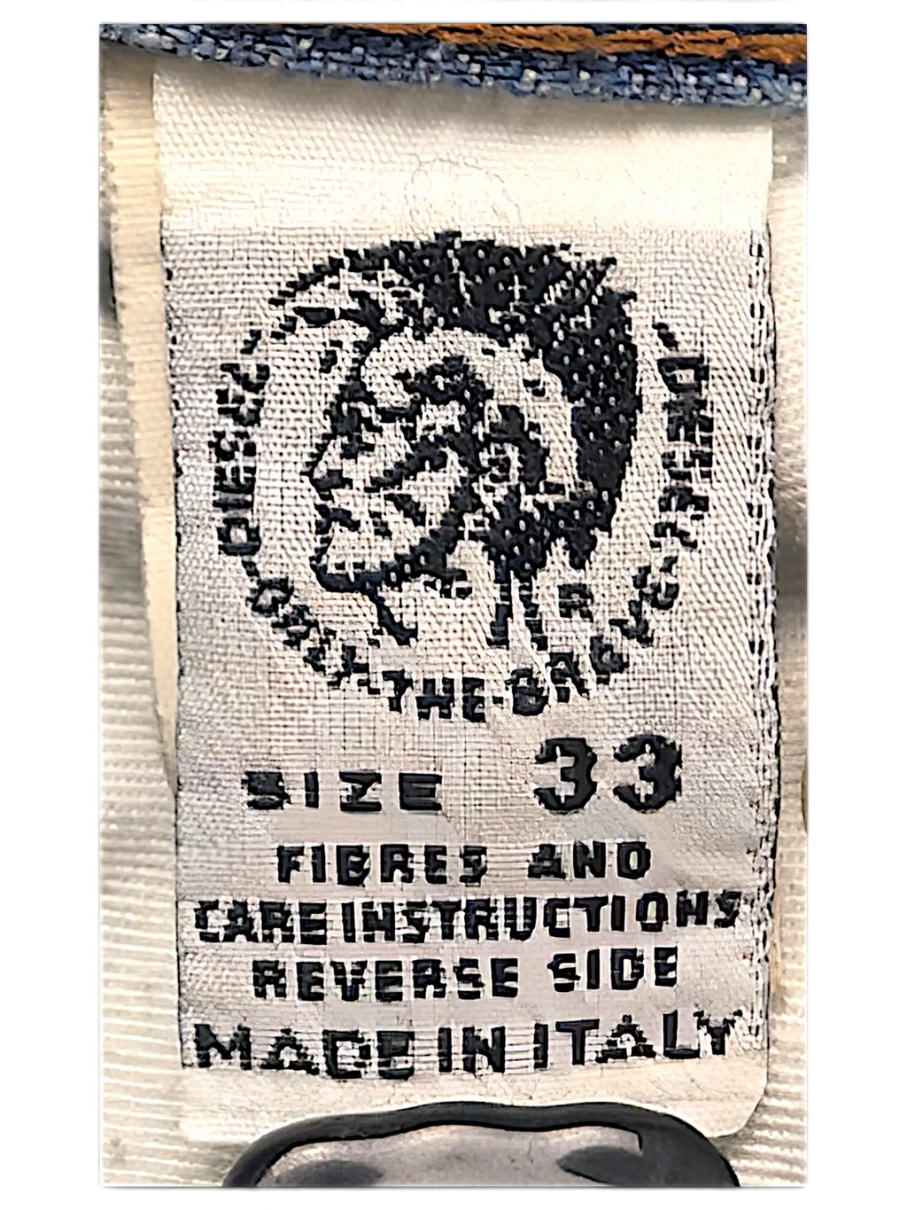 JAKE & IPI Diesel jeans interior care label with size 33 and Made in Italy text on white fabric