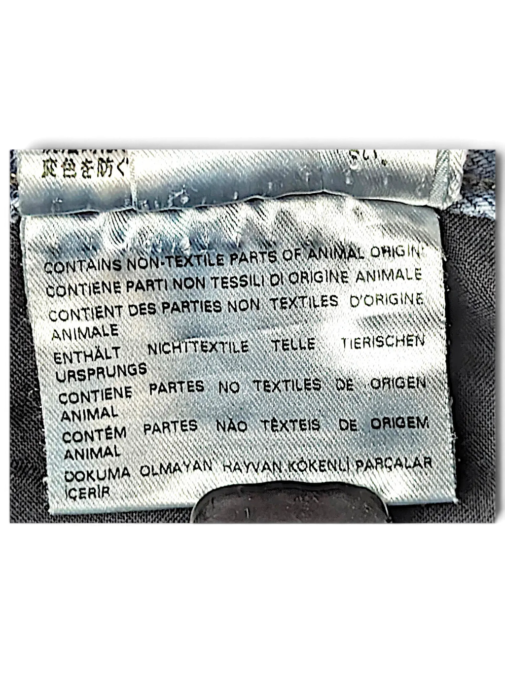 JAKE & IPI Diesel Krayer jeans care label showing non-textile animal origin parts warning in multiple languages.