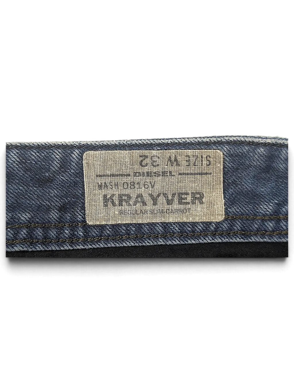 JAKE & IPI Diesel Krayer W32 jeans interior waistband label showing size and wash details on blue denim fabric