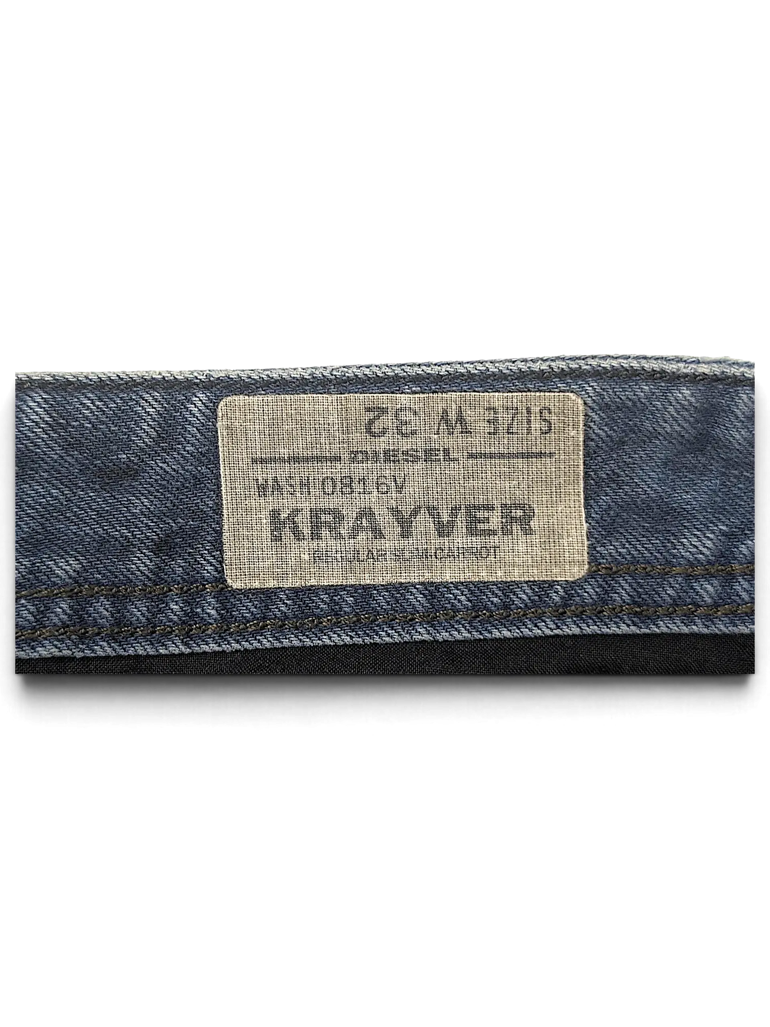 JAKE & IPI Diesel Krayer W32 jeans interior waistband label showing size and wash details on blue denim fabric