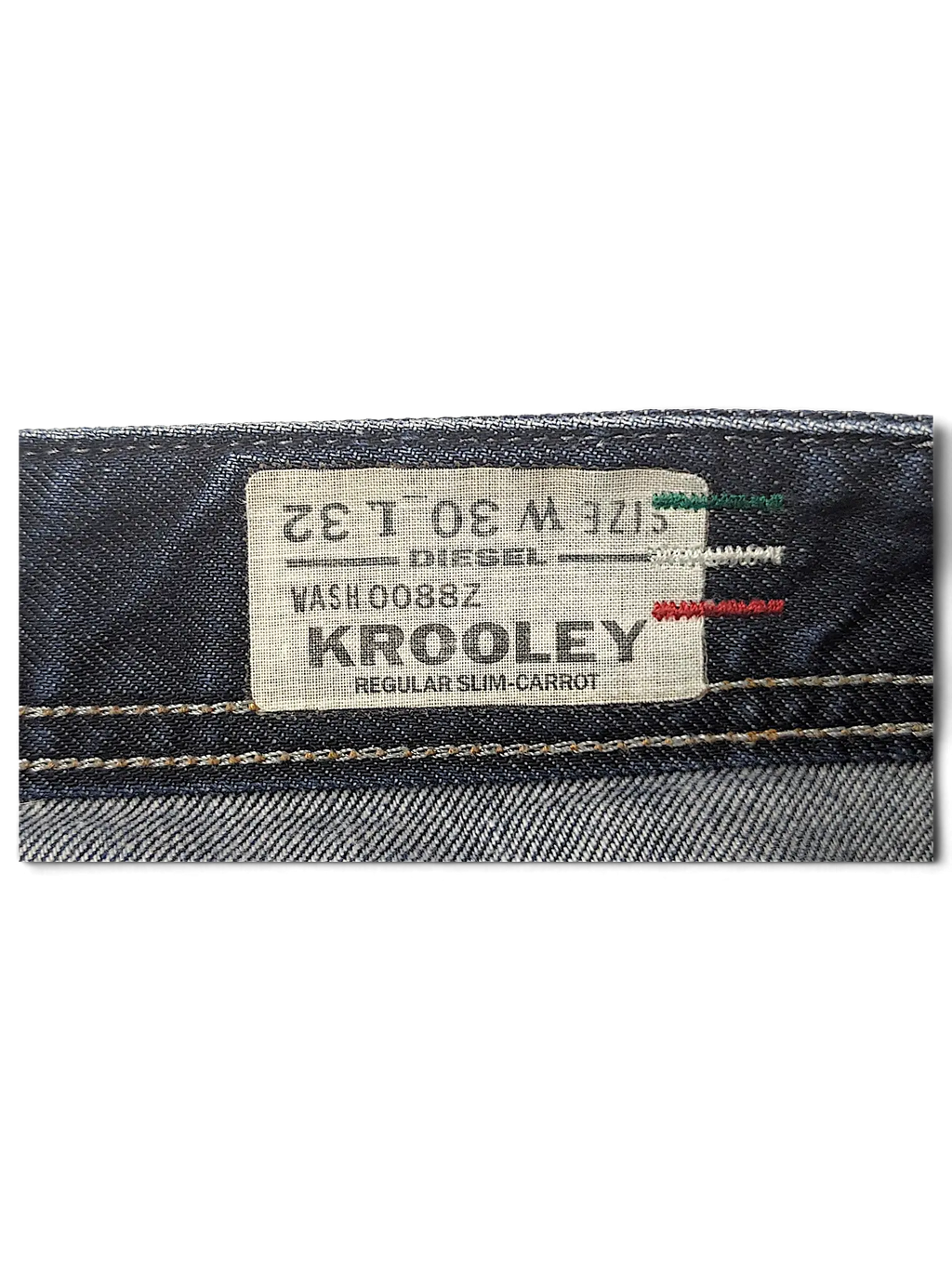 JAKE & IPI Diesel Krooley jeans interior label showing size W30 L32 and regular slim-carrot fit details.