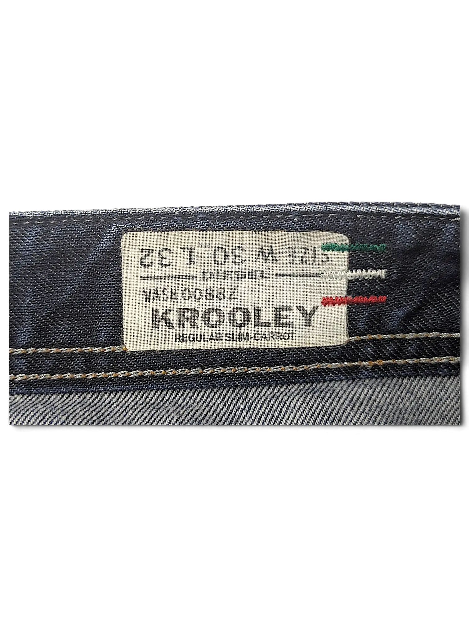JAKE & IPI Diesel Krooley jeans interior label showing size W30 L32 and regular slim-carrot fit details.