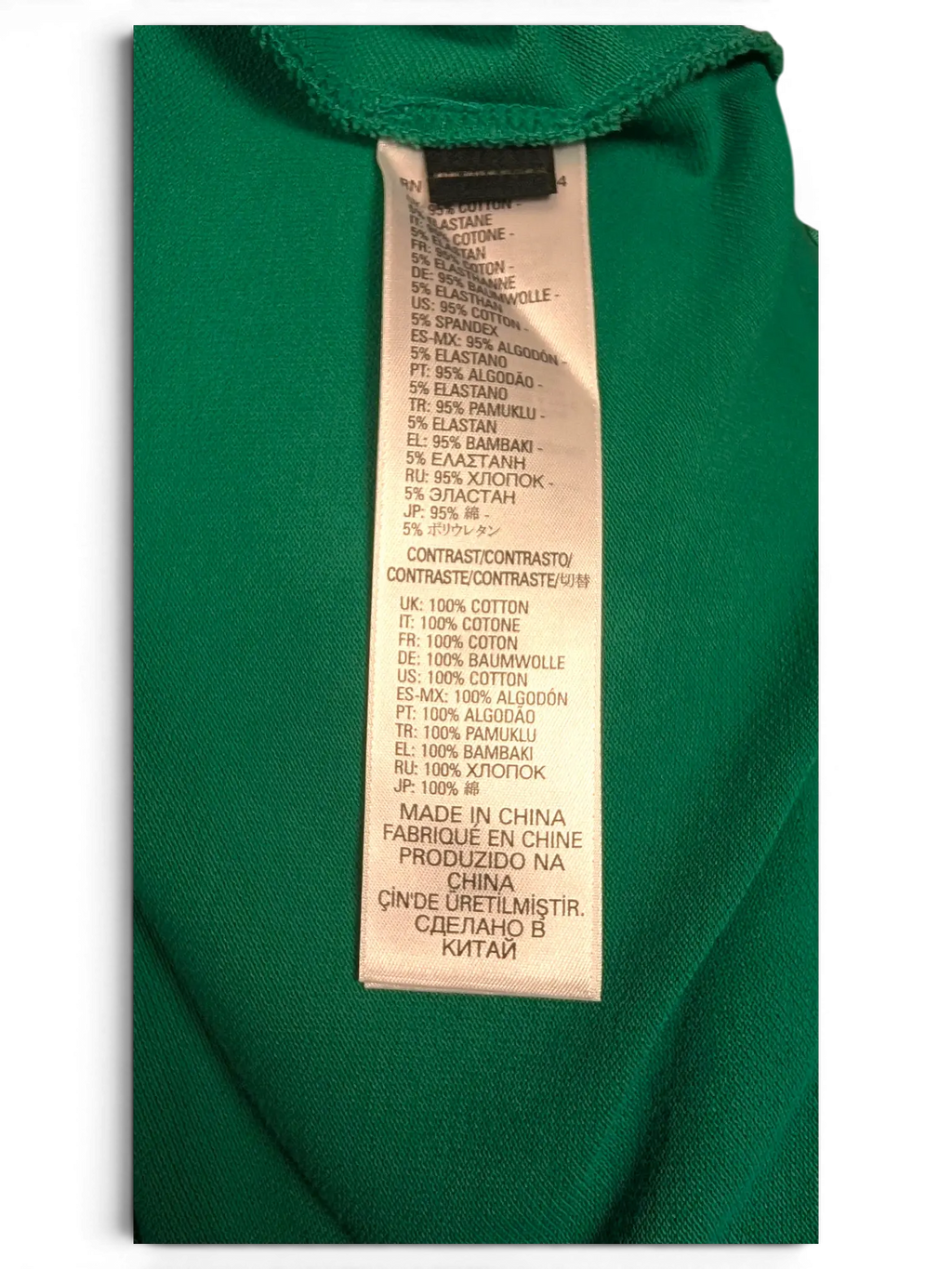JAKE & IPI pre-owned Diesel green polo shirt fabric care label showing 95% cotton and 5% elastane composition